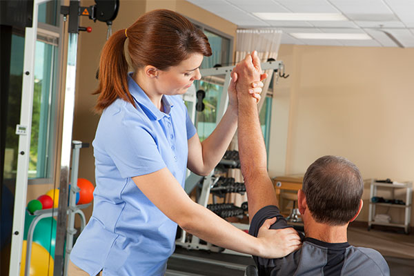 man getting rehab and physiotherapy