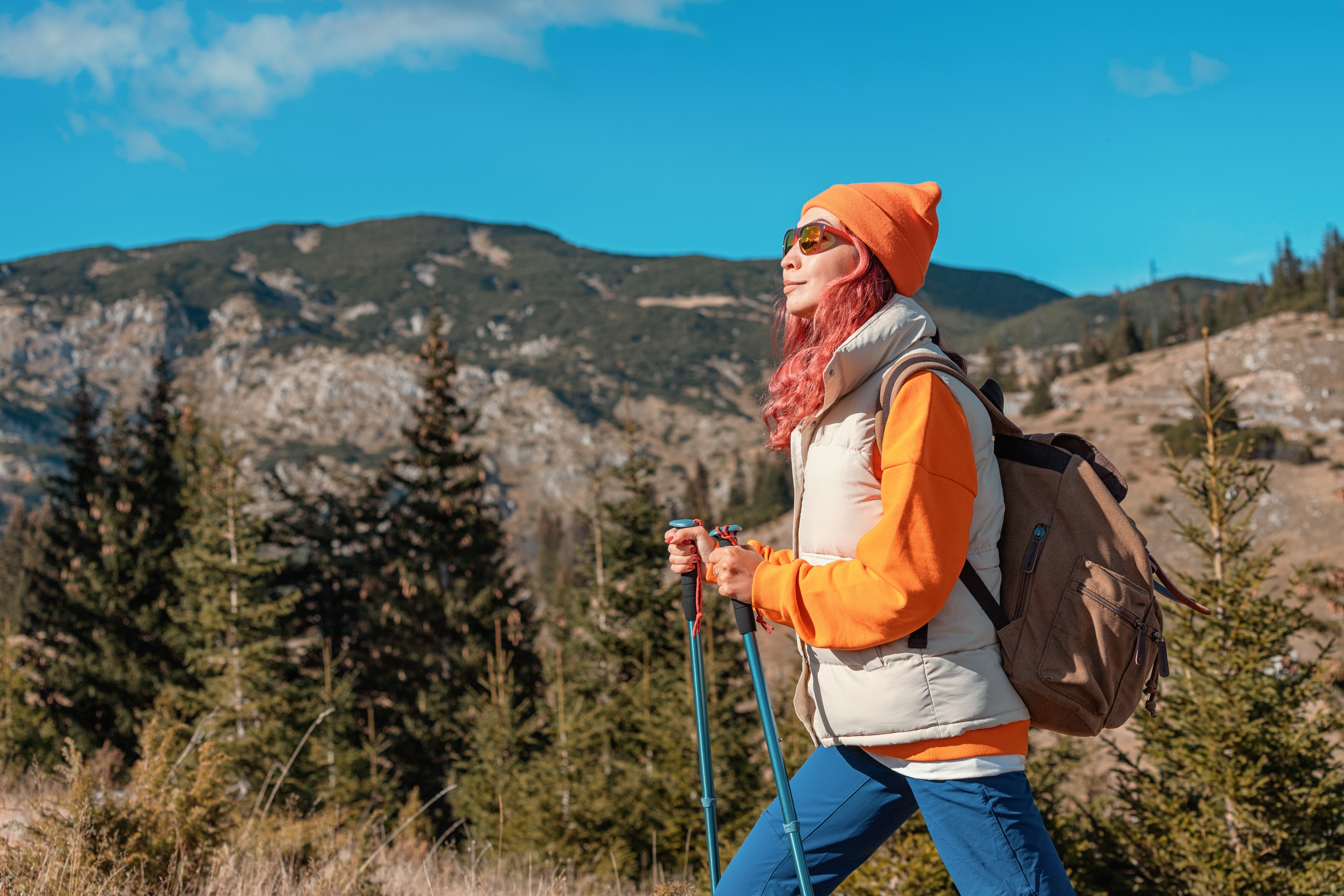 Woman on a hike in the mountains during early spring