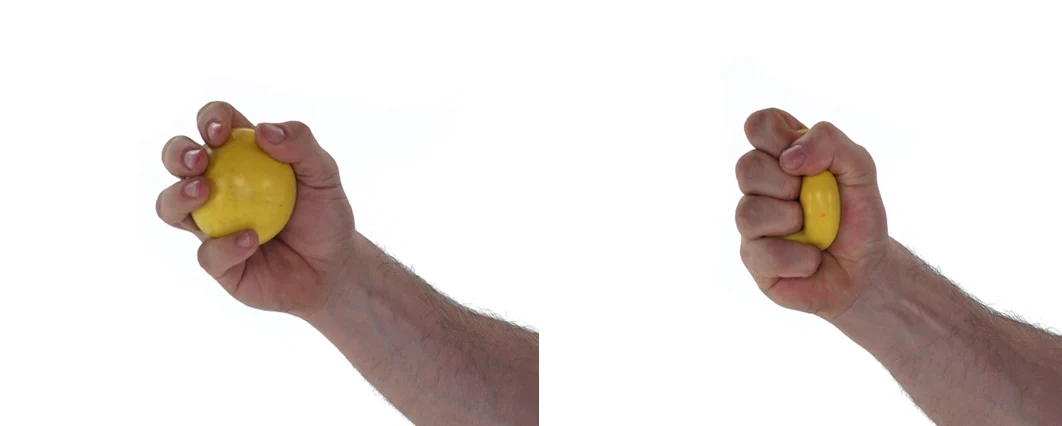 Hand performing ball squeezes for carpal tunnel syndrome relief