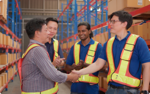 A supervisor welcoming a returning employee back to a workplace, 